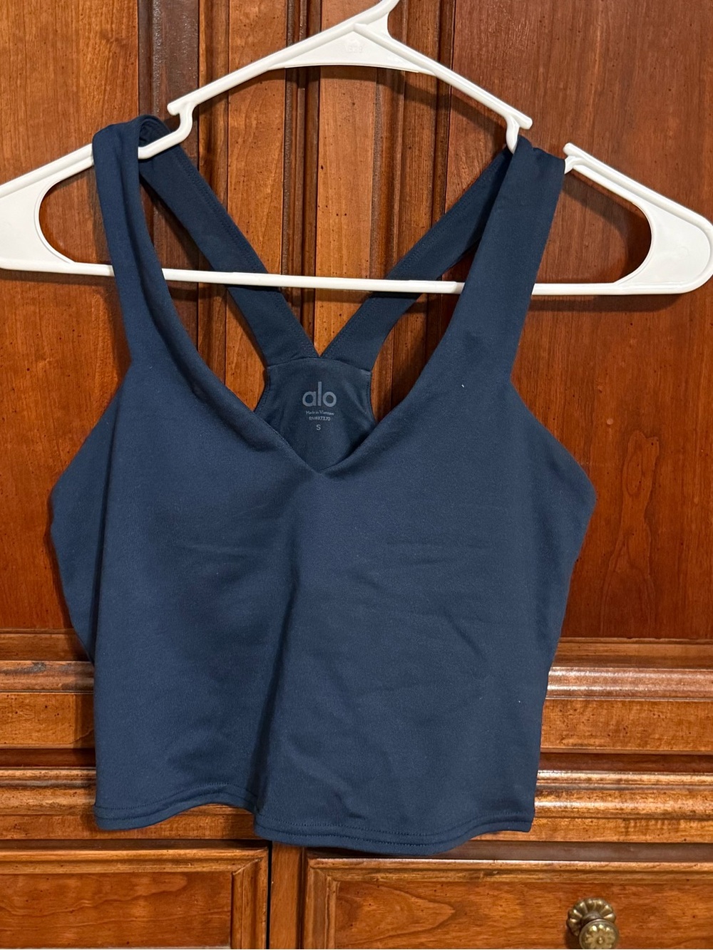 ALO YOGA navy blue sports bra with built in sports bra and removable pads.